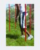 Dynamic Agility Slalom Poles Set: man on red pole in grass for speed